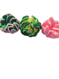 three crocheted flowers on a black background